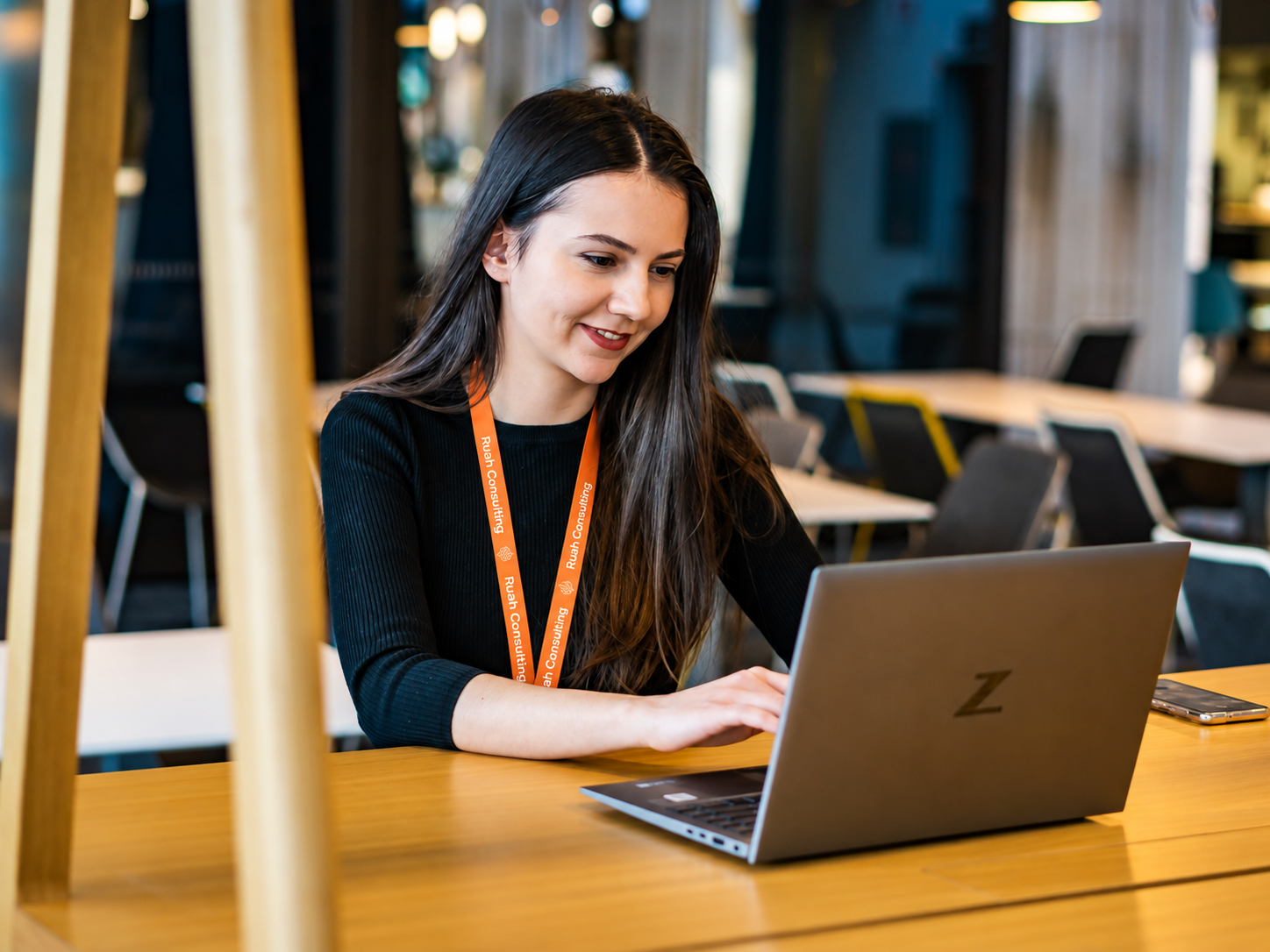 Professional working on a laptop during a Ruah Consulting capability programme
